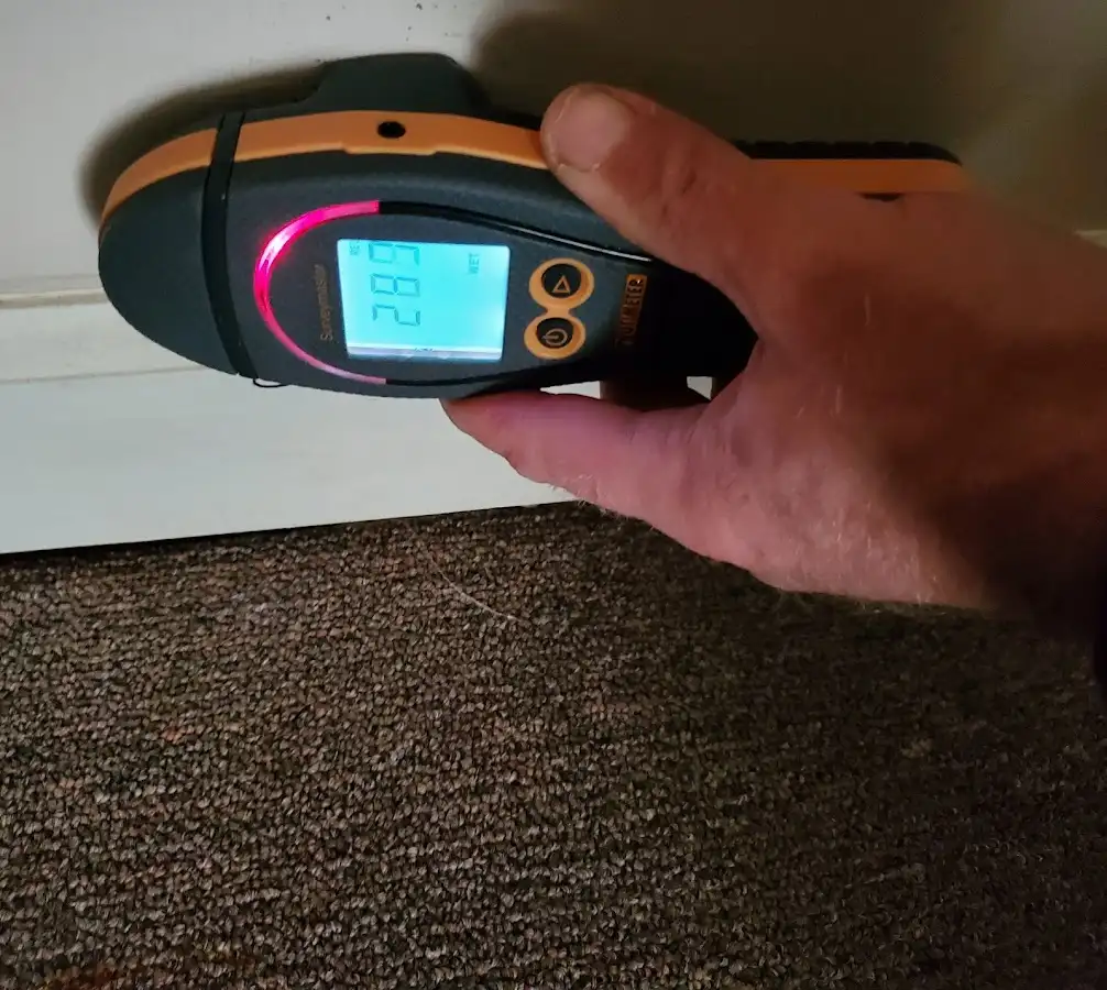 Moisture detection at baseboard during Storm Damage Restoration in Pemberton